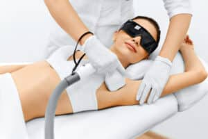 Women recieving laser hair removal on armpit
